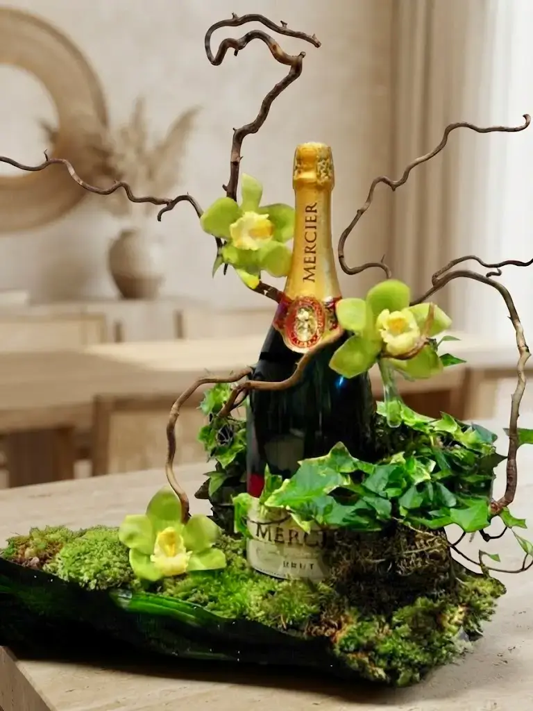 Bouteille de champagne Mercier décorée d'orchidées cymbidium vertes pour cadeau d'exception corporate ou privé par Cindy Gunther